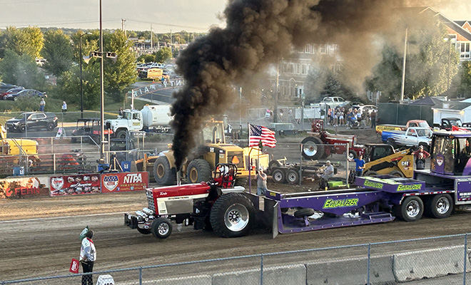 tractor competing in the NTPA Tractor Pull at the Carver County Fair Grandstand