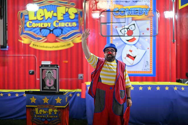 Lew-E the clown waves goodnight to the crowd